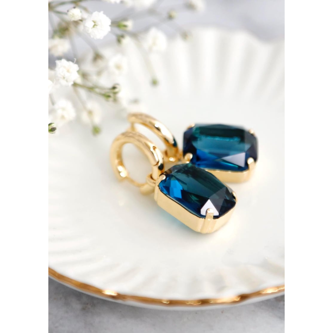 Aretes bañados en oro con cristal azul