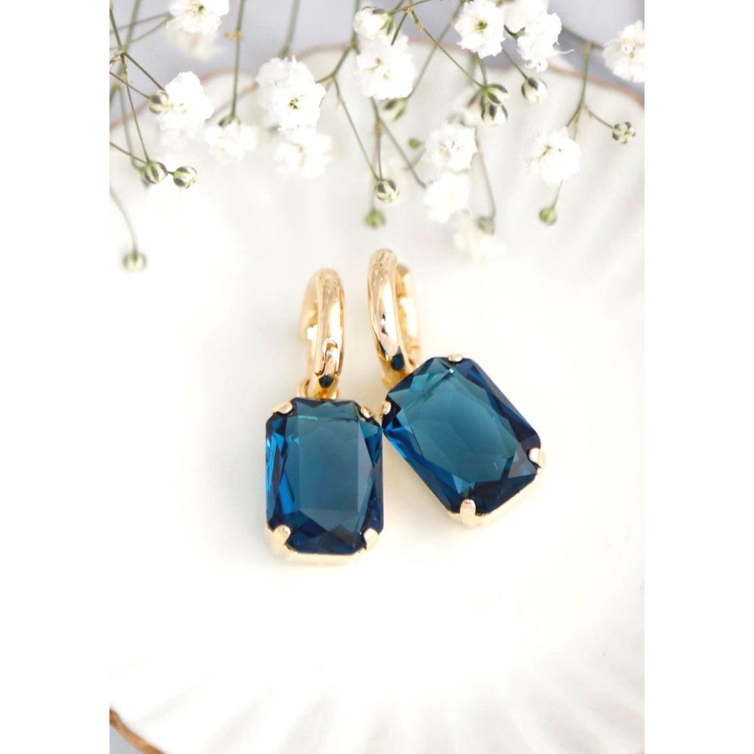 Aretes bañados en oro con cristal azul