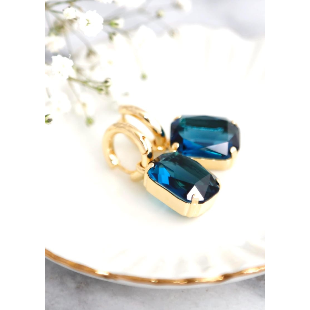 Aretes bañados en oro con cristal azul