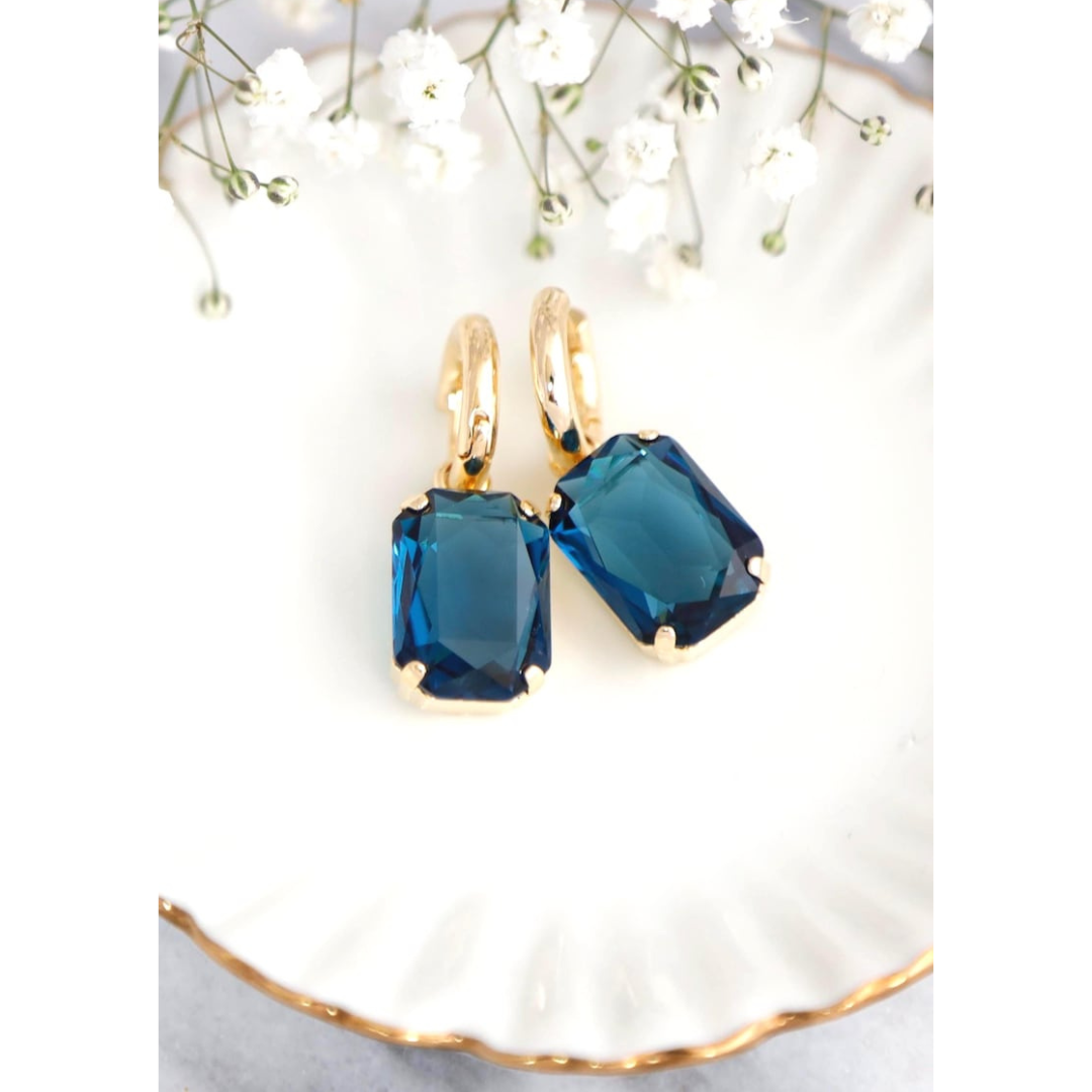 Aretes bañados en oro con cristal azul